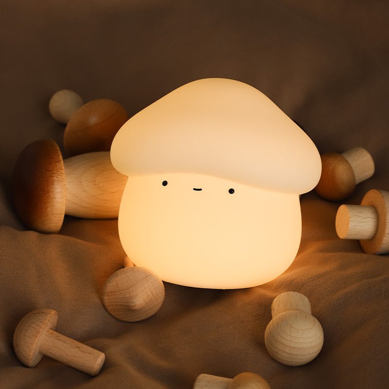 Mushroom-shaped night light with wooden mushrooms on a brown background