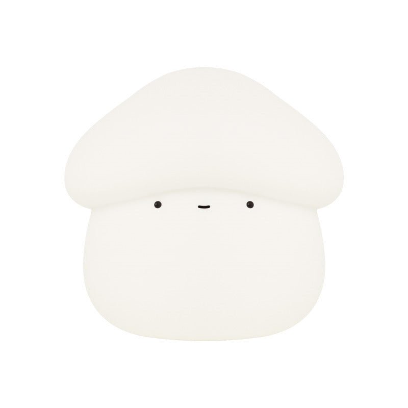 White mushroom-shaped object with black eyes on a white background