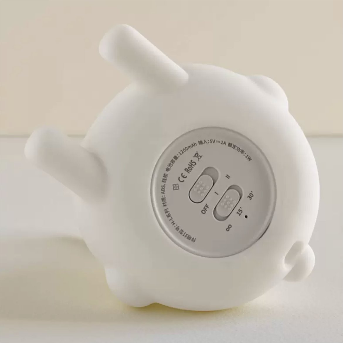 Adorable foldable ear bunny night light with soft silicone body, warm LED glow, tap control, phone stand & hanging function. Rechargeable & portable.