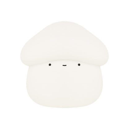White mushroom-shaped object with black eyes on a white background